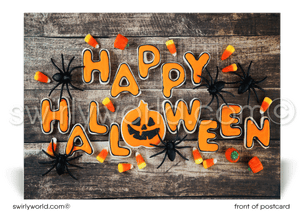 This postcard design features a whimsical "HAPPY HALLOWEEN" message adorned with spooky spiders and candy corn, set against a rustic wood backdrop