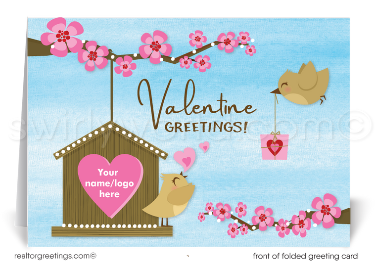 This Valentine's Day greeting card charmingly displays a birdhouse with a pink heart-shaped entrance, where a joyful little bird perches on the branches of a cherry tree, symbolizing the warmth of a home. Another bird approaches, carrying a Valentine's Day gift, adding a playful and joyful element to the scene.