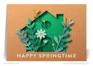 Fresh spring card featuring a green modern house with daisies and leafy accents on a kraft-style backdrop. Customizable message and realtor-friendly design!