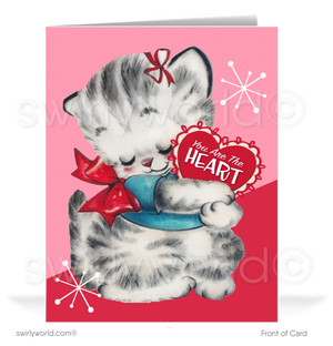 Retro mid-century modern vintage kitten with starbursts holding a Valentine's Day heart-shaped candy box.