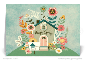 Charming spring card with a flower-covered cottage on a hill, retro “Happy Spring” lettering, and a realtor signpost for custom branding. Perfect for clients!